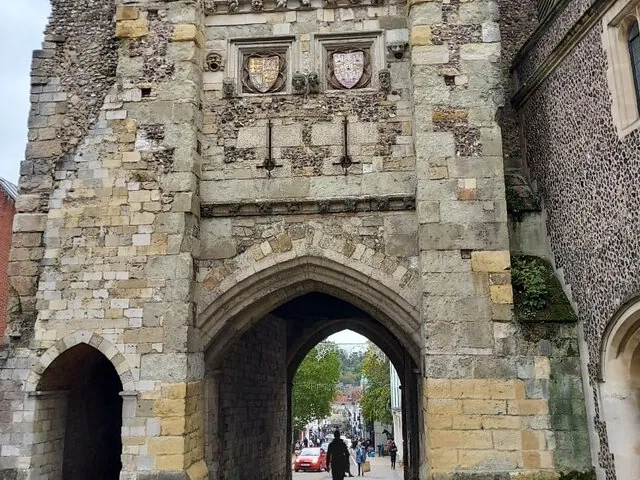 A stone archway building with a small arched opening underneath.